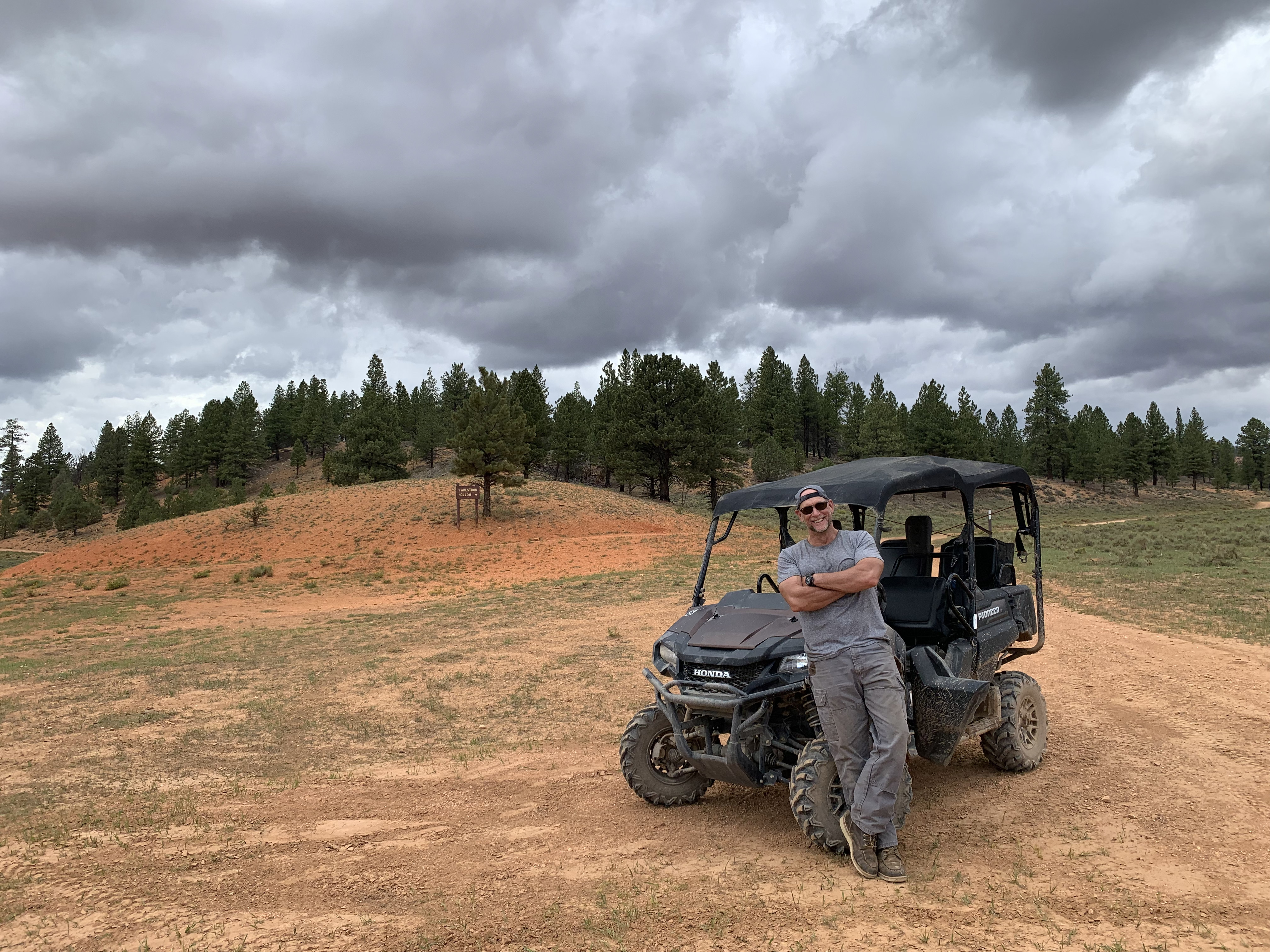 Customer beside an off-road vehicle on a Bryce trail