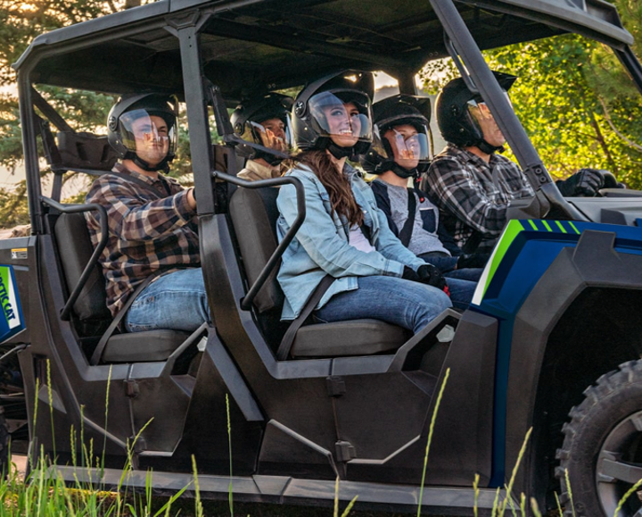 Family seated in an off-road vehicle before a Bryce ATV rental
